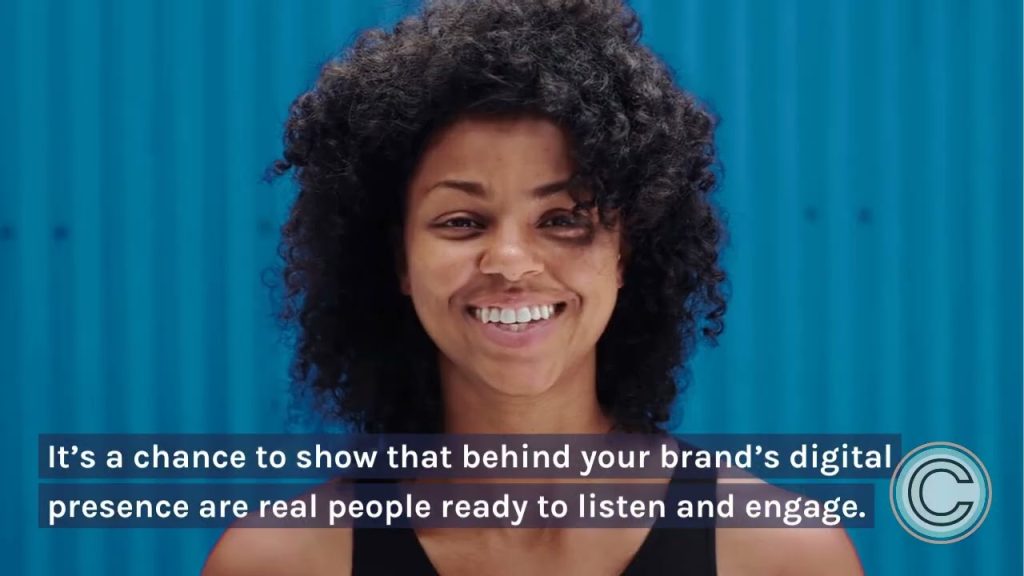 Smiling business professional representing authentic customer engagement, online conversations, comment marketing, and community building on digital platforms.